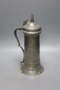 A Charles II pewter flagon, c.1675, with domed lid and turned finial and bifurcated thumbpiece,