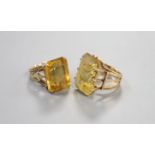 Two yellow metal and citrine set dress rings, one faintly marked 9ct, sizes L/M & P, gross weight