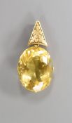 A yellow metal mounted oval citrine pendant, overall 39mm, citrine length 25mm,, gross weight 10.8