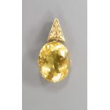 A yellow metal mounted oval citrine pendant, overall 39mm, citrine length 25mm,, gross weight 10.8