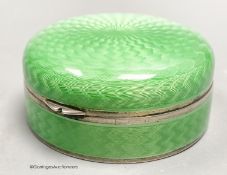 A 1920's continental silver and green guilloche enamel circular box and cover, with mirrored