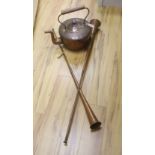 A large Victorian copper kettle with cover, 43cm including handle, and two copper hunting horns