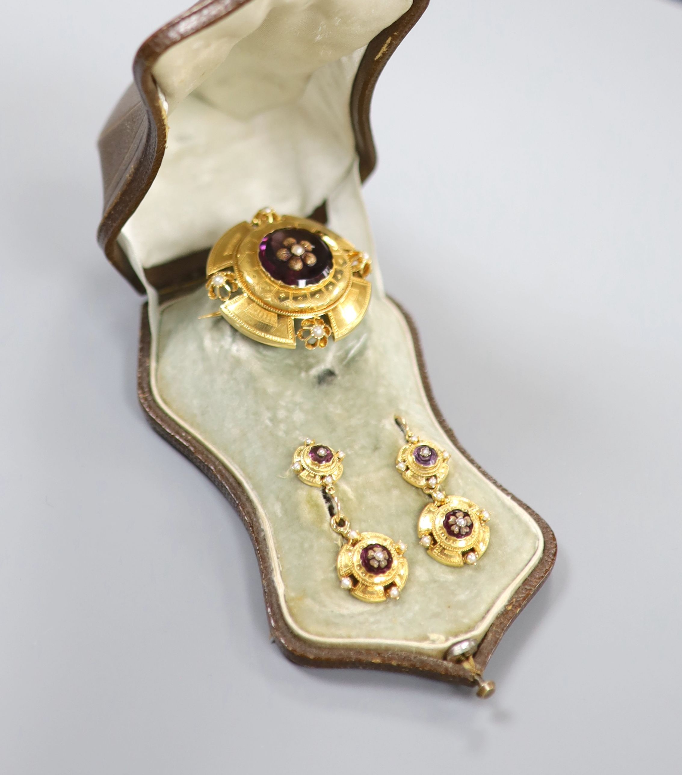 A cased continental Victorian style yellow metal, amethyst paste and seed pearl set demi parure,