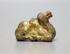 A Chinese gilt bronze figure of a kneeling camel, Han or later