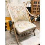 A Victorian faux bamboo folding chair with tapestry upholstery, W.66cm D.50cm H.90cm