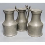 Three 18th century Jersey pewter flagon measures, tallest 27cm, one marked