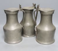 Three 18th century Jersey pewter flagon measures, tallest 27cm, one marked