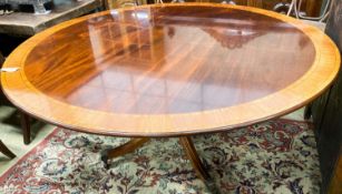 A William Tillman Georgian style mahogany and satinwood circular pedestal dining table,having