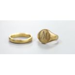 A 9ct gold signet ring, size E, 4.4 grams and an 18ct wedding band, 4 grams.