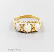 An Edwardian yellow metal, three stone opal and four stone diamond chip set half hoop ring, size Q/