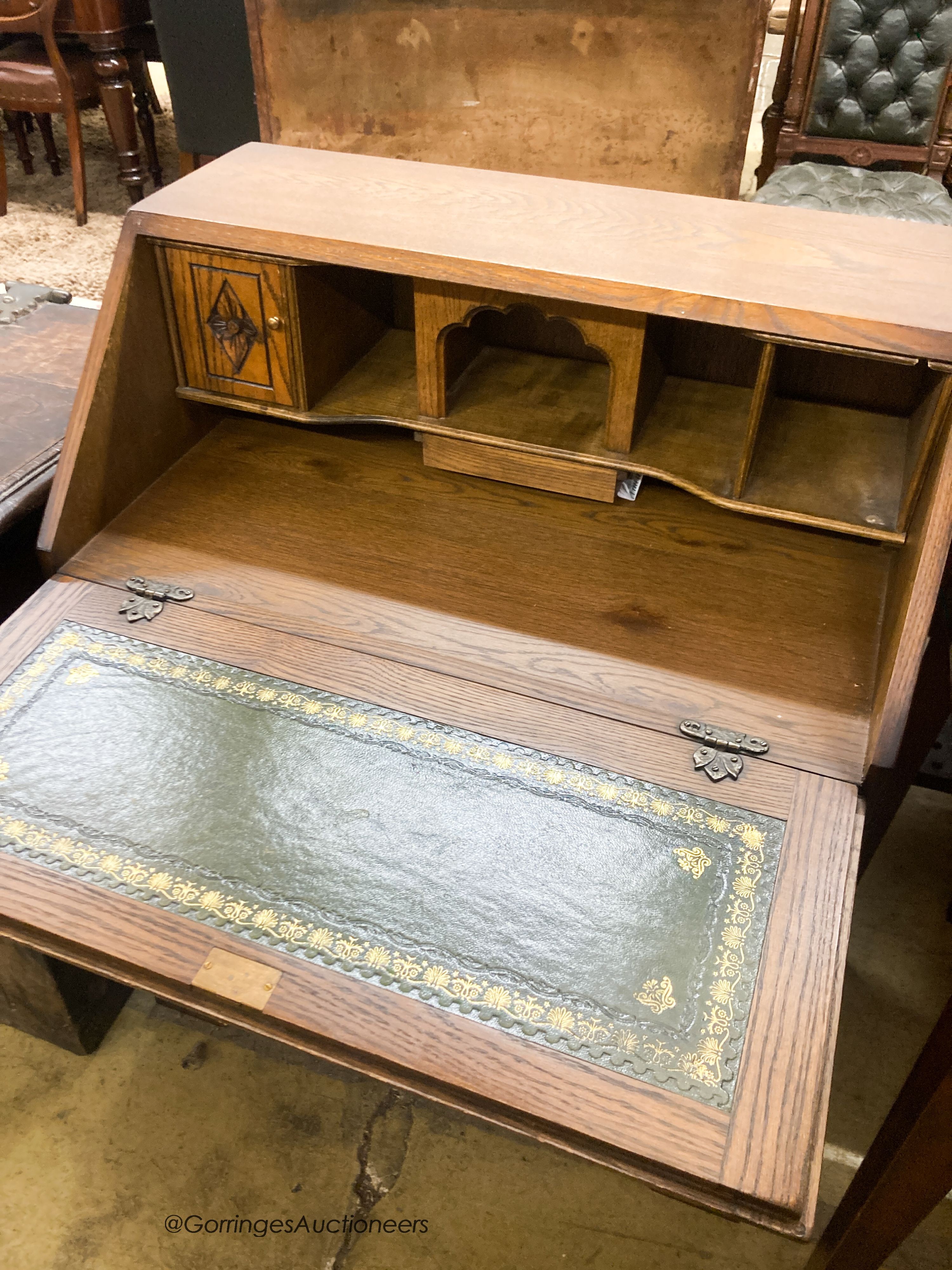 A reproduction oak linenfold carved bureau, W.75cm D.48cm H.99cm - Image 2 of 4