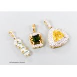 Three assorted modern 18ct gold and gem set pendants, including sphalerite and diamond, overall