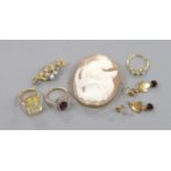 A 9ct gold and citrine set ring, two other gem set rings, a 9ct mounted cameo brooch, a yellow