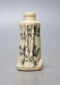 A Chinese carved bone snuff bottle, with cover, 6cm