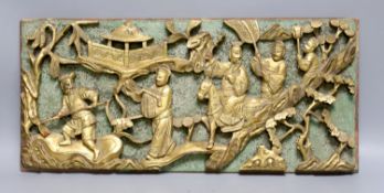 A Chinese carved giltwood plaque, 20 x 46cm