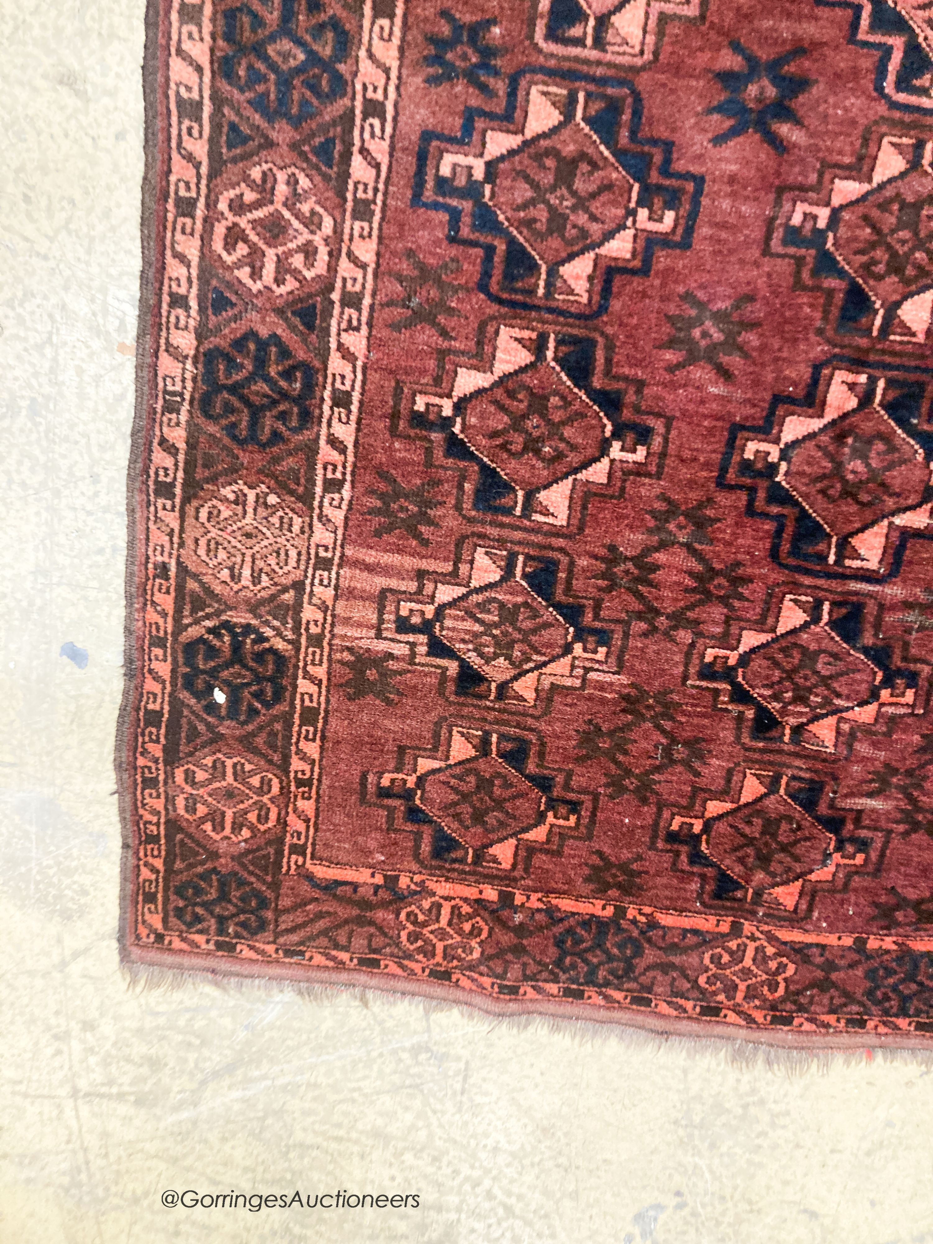 A Bokhara burgundy ground rug, 190 x 105cm - Image 4 of 5