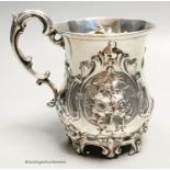A Victorian embossed silver mug, George John Richards, London 1856, 12.5cm, 7.5 oz.
