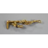 A 9ct gold and seed pearl set riding crop and foliate bar brooch, 47mm, gross weight 2.3 grams.