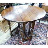 An 18th century style oval oak gateleg table, 100cm extended, depth 83cm, height 74cm