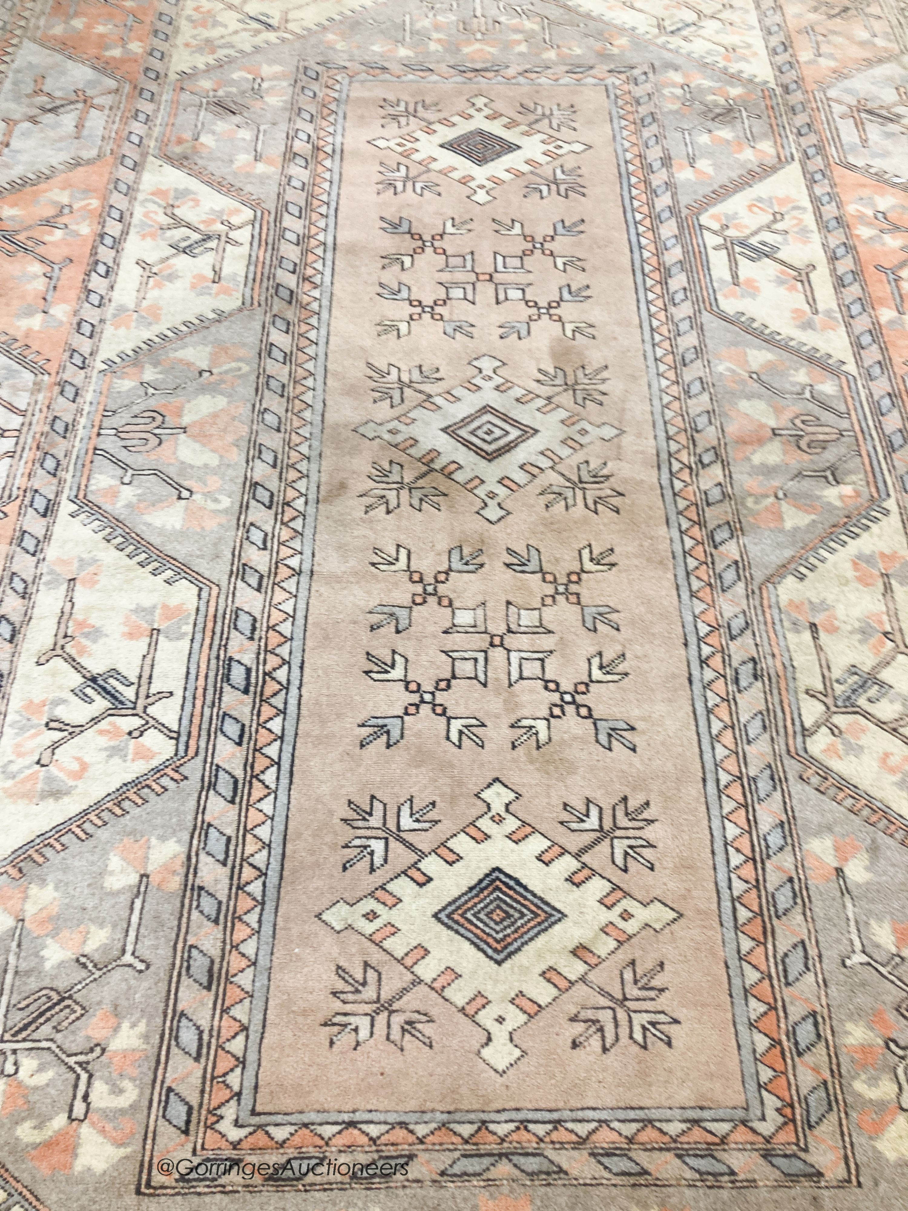 A large Caucasian Turkish design fawn ground carpet, 420 x 300cm - Image 4 of 7