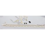 A modern 585 flat curb link chain, 50cm, hung with a 14k cupid charm, gross 10.1 grams, a 375 and