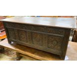 A 17th century carved oak coffer, length 140cm, depth 53cm, height 58cm