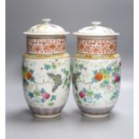 A pair of Chinese famille rose vase and covers, height 26cm