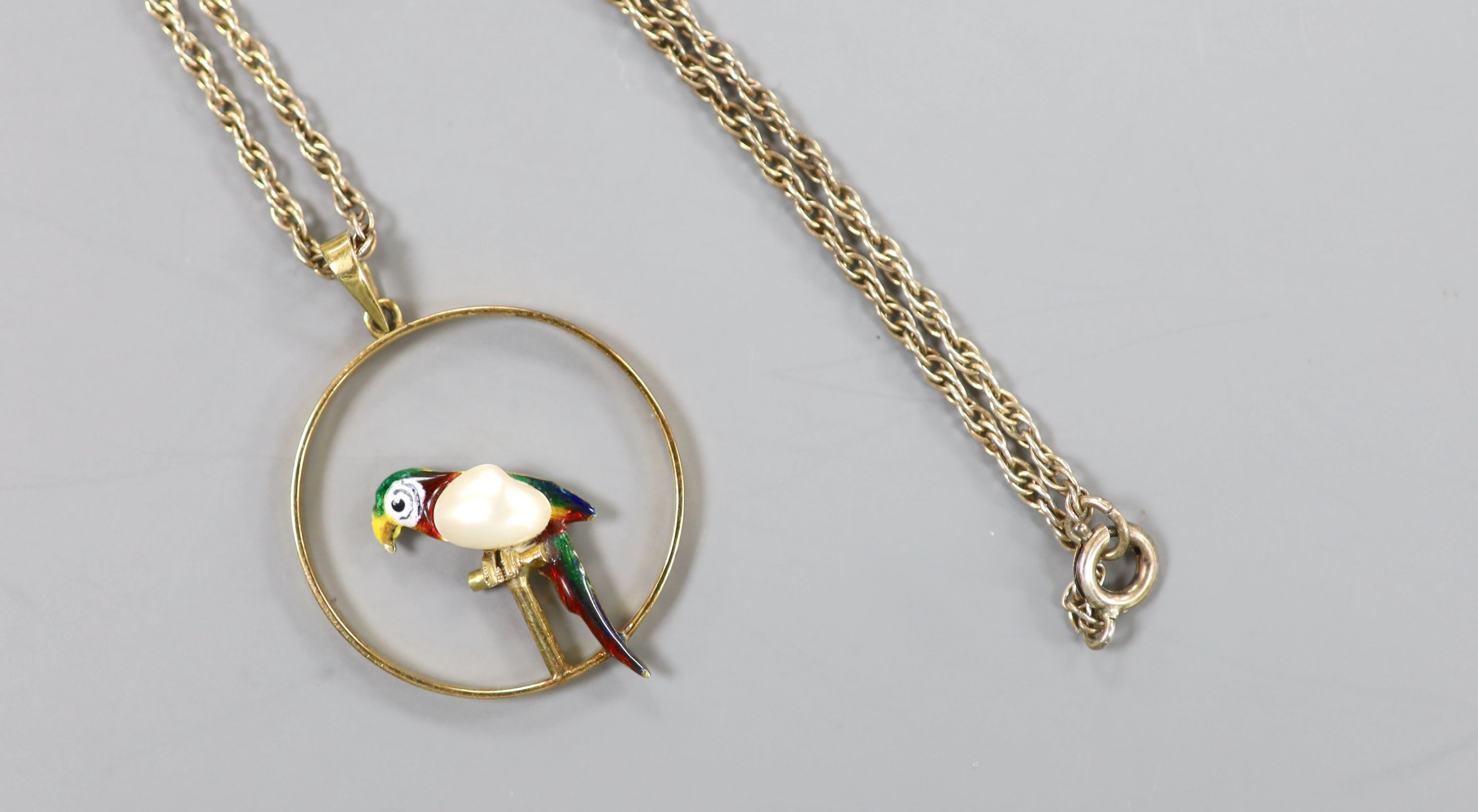 An early 20th century 15ct, enamel and baroque pearl set open work circular pendant, 22mm, gross 2.