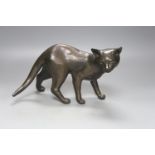 A Tom Merrifield bronze cat, signed and numbered 7/95, 28cm long