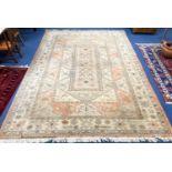 A large Caucasian Turkish design fawn ground carpet, 420 x 300cm