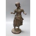 After Moreau. A bronze female figure, script signature to circular base, height 38cm