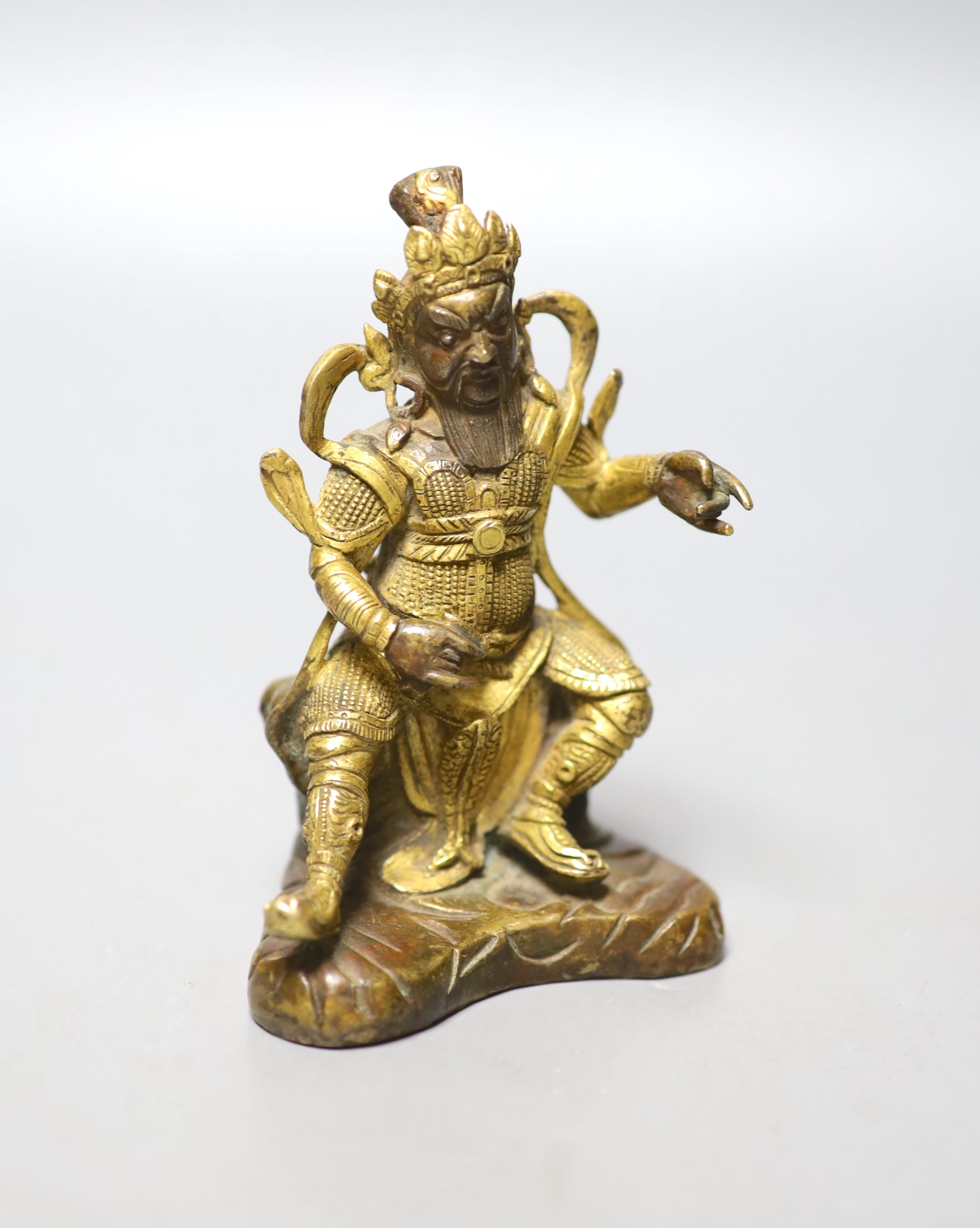 A Sino-Tibetan gilt bronze seated figure of Guandi, 10cm