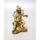 A Sino-Tibetan gilt bronze seated figure of Guandi, 10cm