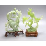 Two Chinese green bowenite jade carvings of exotic birds, H 28cm with carved wooden stands