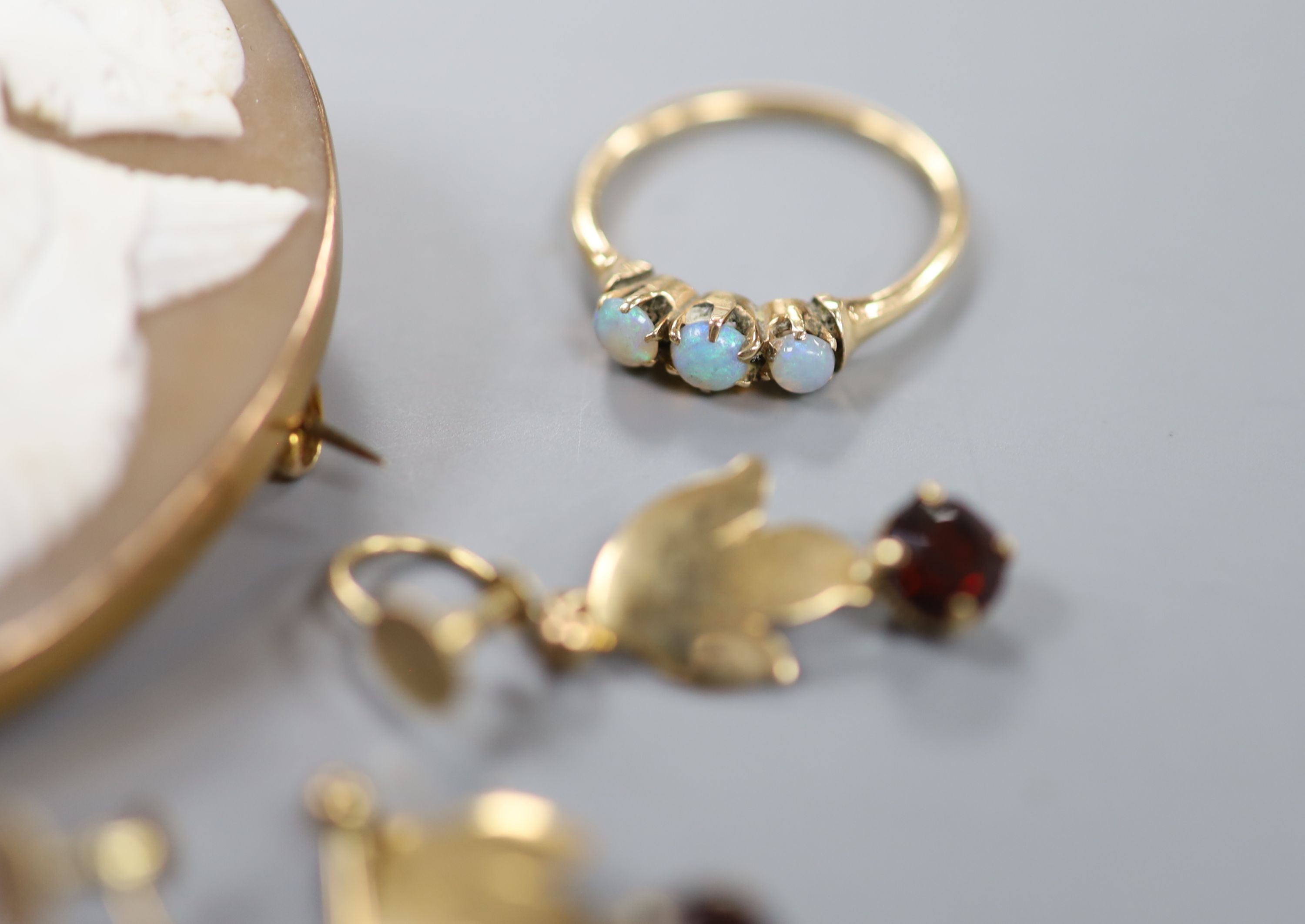 A 9ct gold and citrine set ring, two other gem set rings, a 9ct mounted cameo brooch, a yellow - Image 2 of 3