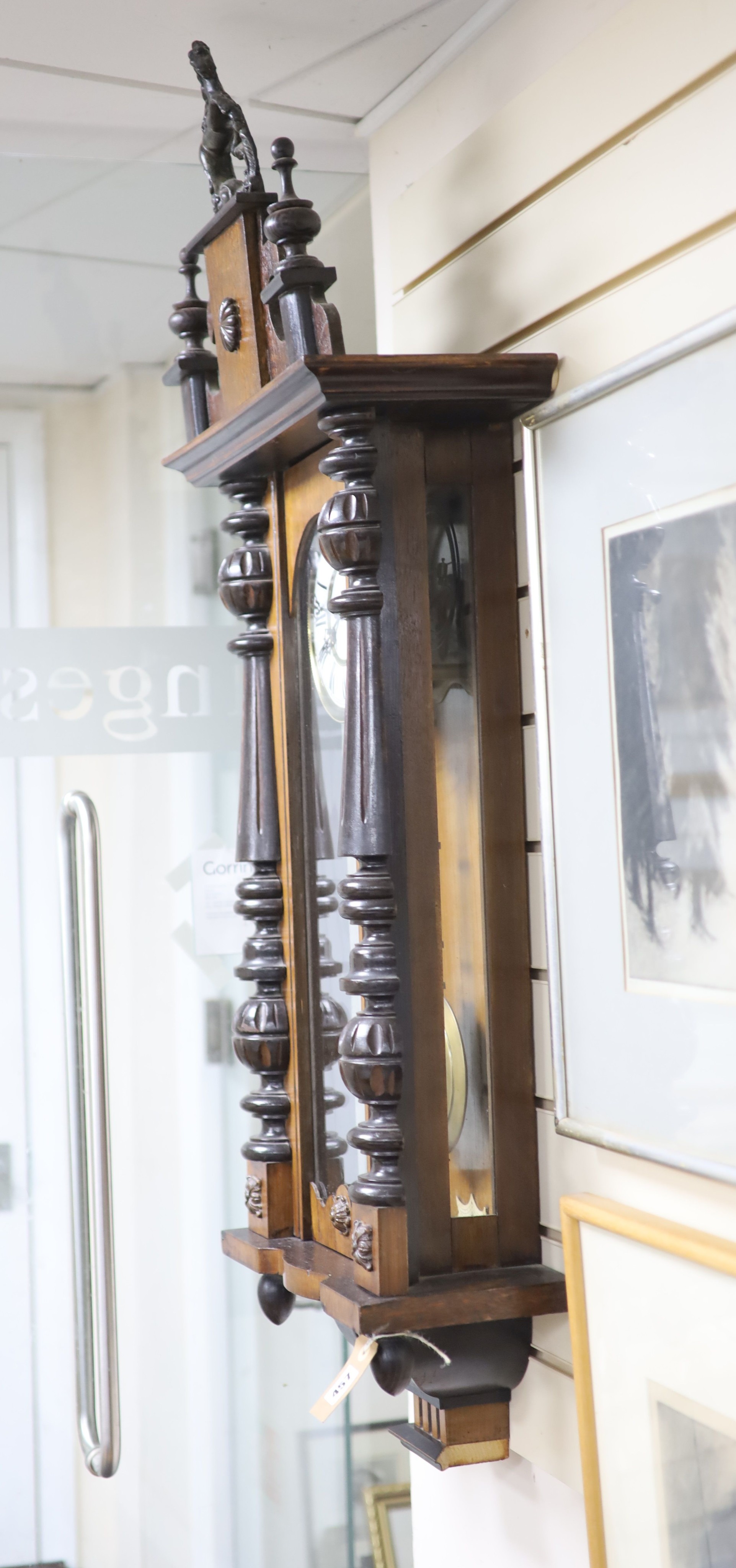 A 19th century Continental regulator in architectural walnut case, with key and gridiron pendulum, - Image 6 of 6