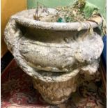 A reconstituted stone garden planter, diameter 50cm H.54cm