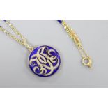 A yellow metal, blue enamel and rose cut diamond set monogrammed circular locket (a.f.) 29mm, on a