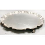 A circular silver salver with Chippendale border, diameter 41cm, Birmingham 1950, 63.5oz.