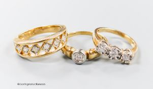 Three assorted modern 9ct gold and diamond set dress rings, including illusion set three stone and