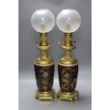 A pair of 19th century French ormolu and enamelled oil lamps, height 46cm