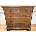 A mid 19th century oak and pollard oak chest fitted four long graduated drawers, width 114cm, depth