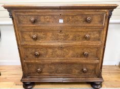 A mid 19th century oak and pollard oak chest fitted four long graduated drawers, width 114cm, depth