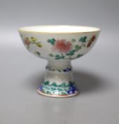 A 19th century Chinese famille stem cup, 12cm diameter