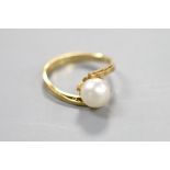A modern 18k and cultured pearl set ring, size L, gross 2.4 grams.