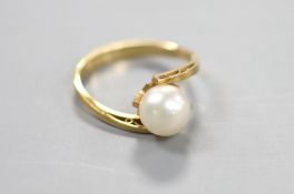 A modern 18k and cultured pearl set ring, size L, gross 2.4 grams.