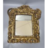 A 19th century gilt composition rectangular mirror in the Baroque style