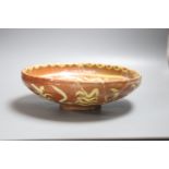 A Persian slipware bowl, circa 10th century, 24.5cm (a.f.)