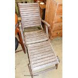A weathered teak folding garden steamer chair