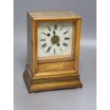 A 19th century walnut cased Black Forest mantel clock, bell striking movement with pendulum, height